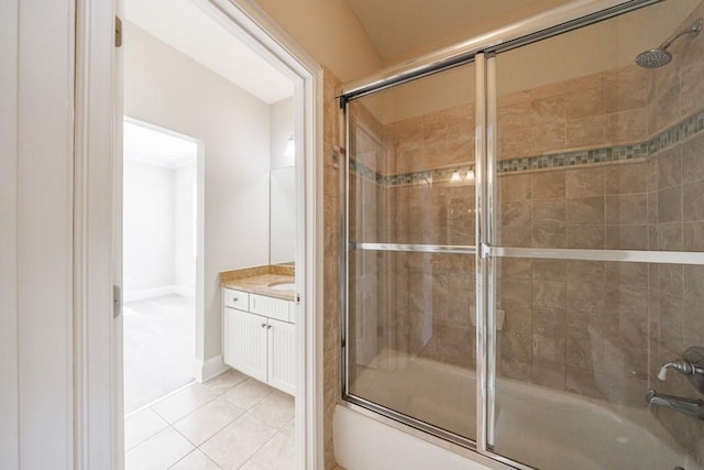 full bathroom featuring vanity, tile patterned flooring, and enclosed tub / shower combo