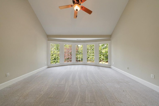 unfurnished room featuring carpet flooring, high vaulted ceiling, and ceiling fan