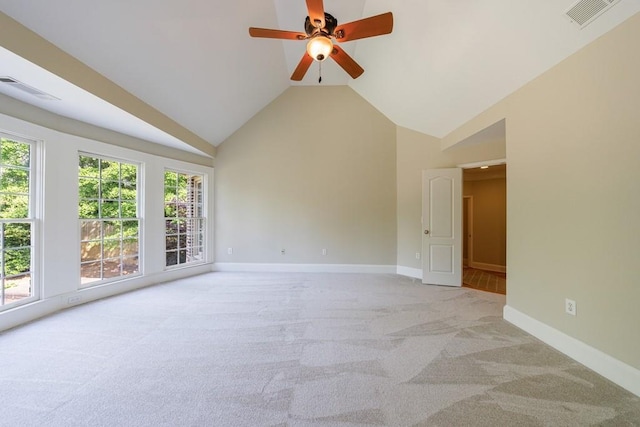 unfurnished room featuring visible vents, a ceiling fan, light carpet, baseboards, and high vaulted ceiling