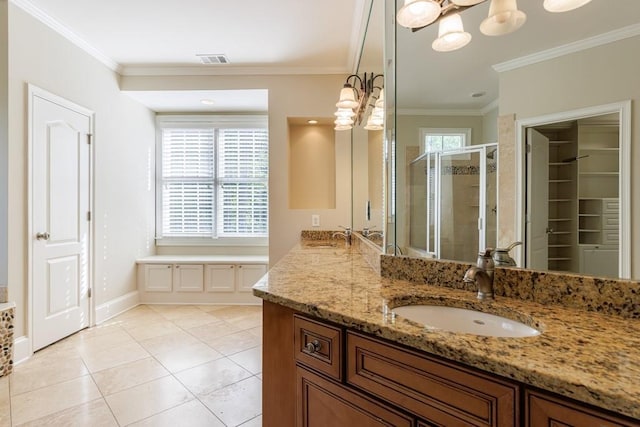 full bathroom with a shower stall, crown molding, baseboards, a notable chandelier, and visible vents