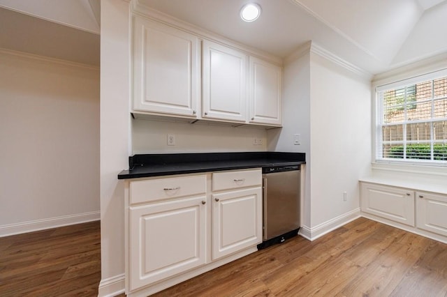 kitchen featuring light wood-type flooring, dishwasher, baseboards, and white cabinetry