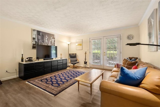 living area with baseboards, french doors, a textured ceiling, and wood finished floors