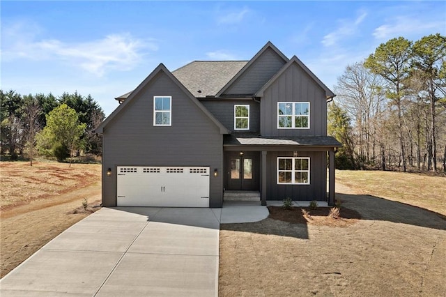 craftsman-style house with an attached garage, board and batten siding, and concrete driveway