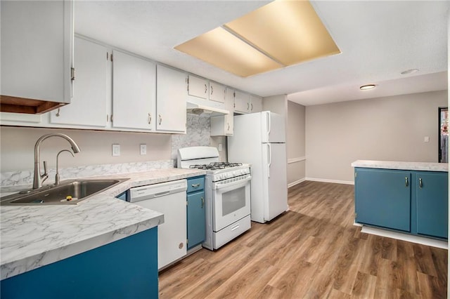 kitchen with blue cabinets, sink, light wood-type flooring, white appliances, and white cabinets