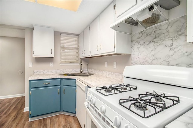 kitchen featuring white cabinetry, sink, white appliances, and blue cabinetry