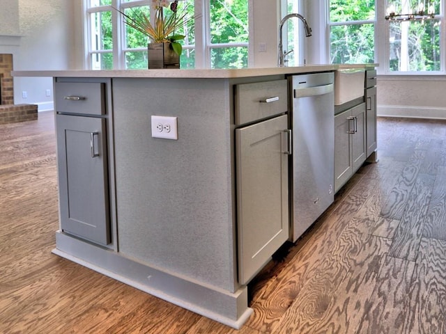 3730 Reserve Overlook Way, Cumming, GA 30041 - kitchen with gray cabinets, stainless steel dishwasher, dark wood-style floors, and a center island with sink