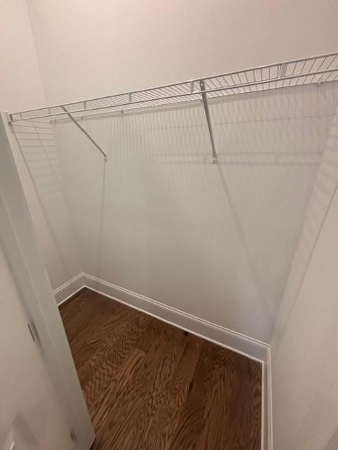 spacious closet with wood finished floors