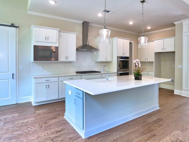 3730 Reserve Overlook Way, Cumming, GA 30041 - kitchen featuring wall chimney range hood, stainless steel appliances, a sink, white cabinets, and dark wood-style flooring