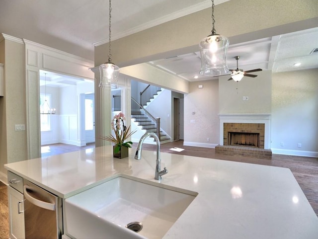 3730 Reserve Overlook Way, Cumming, GA 30041 - kitchen with a sink, ceiling fan, wood finished floors, hanging light fixtures, and crown molding