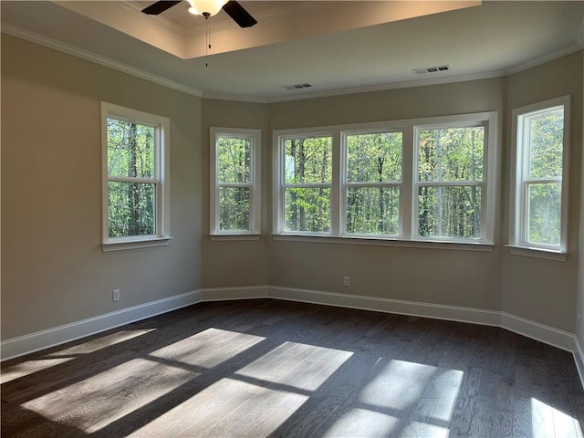unfurnished room with dark wood-style floors, baseboards, a ceiling fan, and ornamental molding