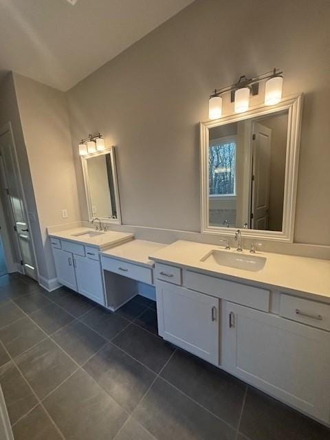 bathroom with tile patterned flooring and vanity