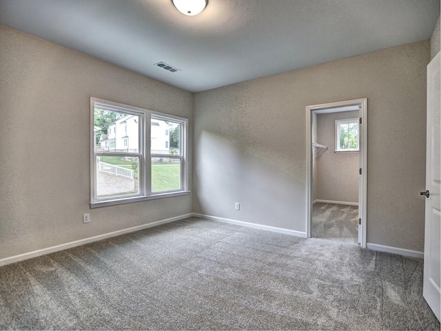 3730 Reserve Overlook Way, Cumming, GA 30041 - spare room featuring healthy amount of natural light, carpet flooring, a textured wall, and baseboards