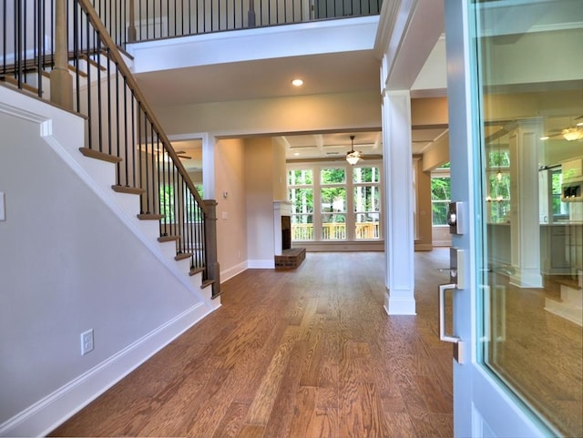 3730 Reserve Overlook Way, Cumming, GA 30041 - foyer entrance featuring ceiling fan, ornate columns, wood finished floors, baseboards, and stairway
