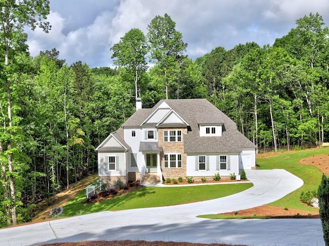 3730 Reserve Overlook Way, Cumming, GA 30041 - view of front of home featuring driveway, a front lawn, and a forest view