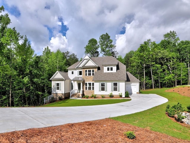 3730 Reserve Overlook Way, Cumming, GA 30041 - view of front facade featuring driveway, a front yard, and stone siding