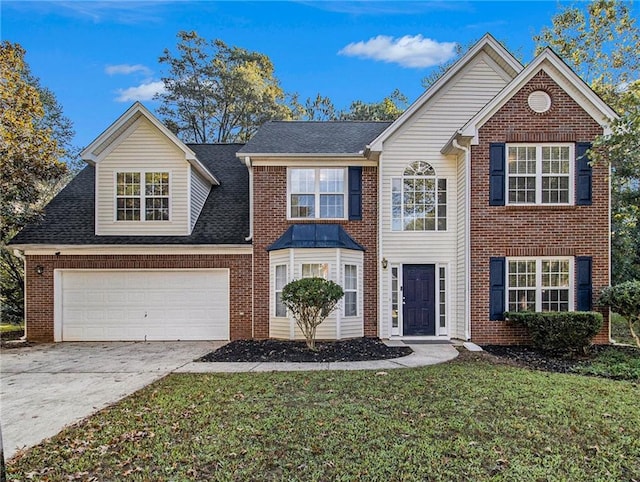 front facade with a front yard and a garage