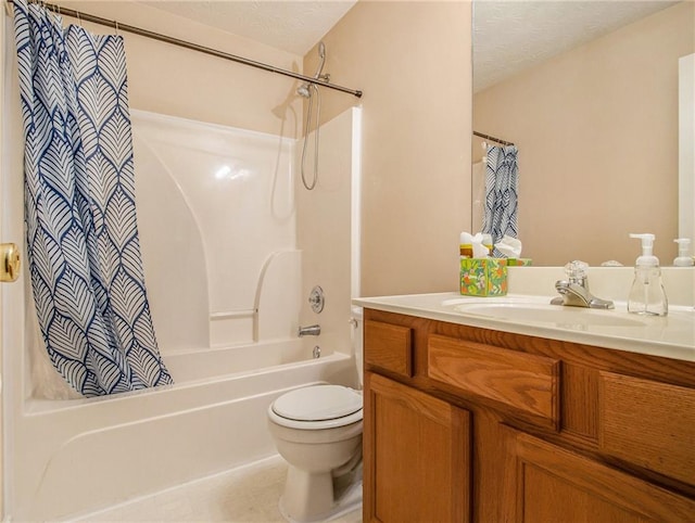 full bathroom with vanity, toilet, a textured ceiling, and shower / bath combo