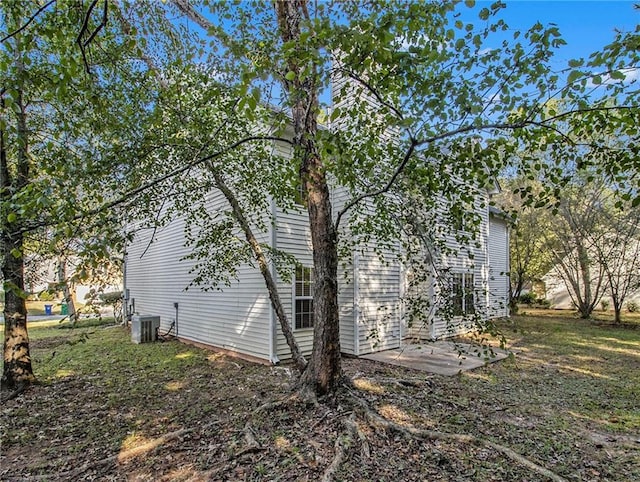 view of side of home featuring cooling unit