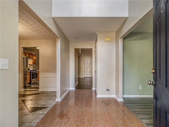 foyer entrance with light wood-type flooring