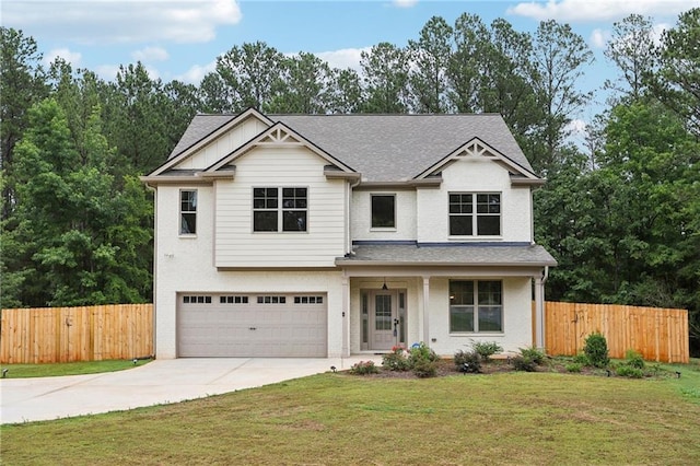 view of front of home with a front lawn, concrete driveway, fence, and an attached garage