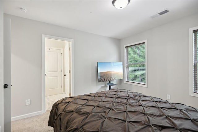 bedroom featuring carpet flooring, visible vents, and baseboards