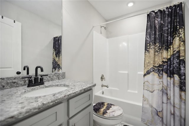 bathroom with toilet, shower / tub combo, and vanity