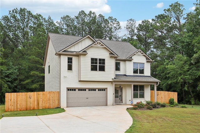 view of front of property with an attached garage, brick siding, fence, concrete driveway, and board and batten siding