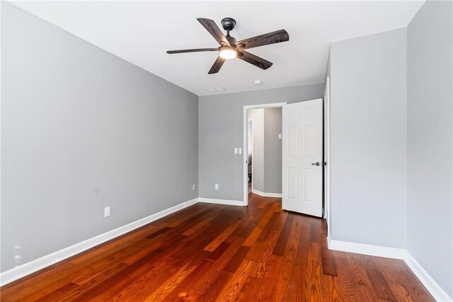 unfurnished bedroom featuring baseboards, ceiling fan, and wood finished floors