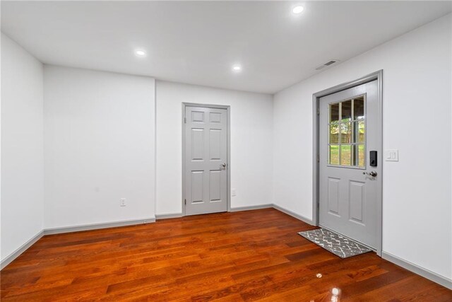 interior space with visible vents, recessed lighting, baseboards, and wood finished floors