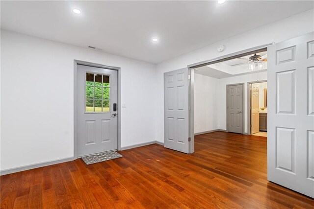 foyer entrance featuring visible vents, recessed lighting, baseboards, and wood finished floors