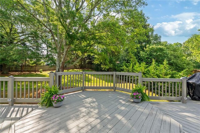 wooden deck featuring fence