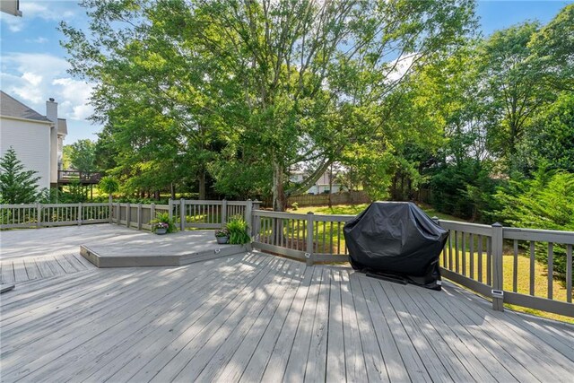 wooden deck featuring grilling area