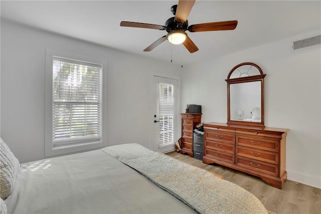 bedroom with light wood-type flooring and ceiling fan