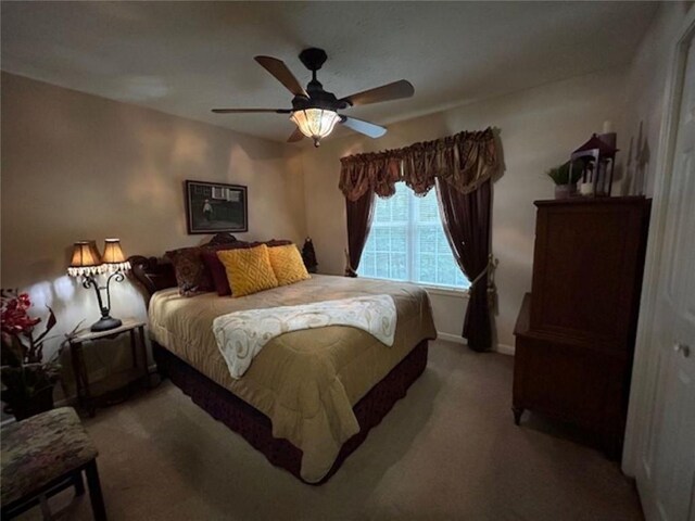 bedroom with light carpet and ceiling fan