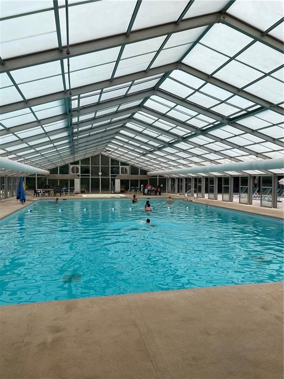 view of swimming pool with a lanai