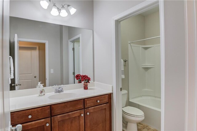 full bath with toilet, shower / washtub combination, and vanity