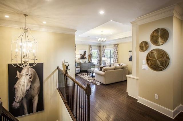 interior space featuring a notable chandelier, wood-type flooring, and crown molding