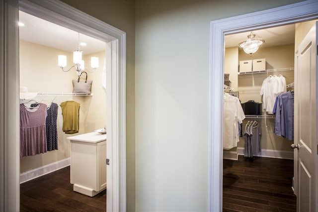 bathroom with hardwood / wood-style floors and a chandelier