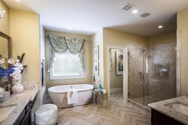 bathroom with vanity, independent shower and bath, and parquet flooring