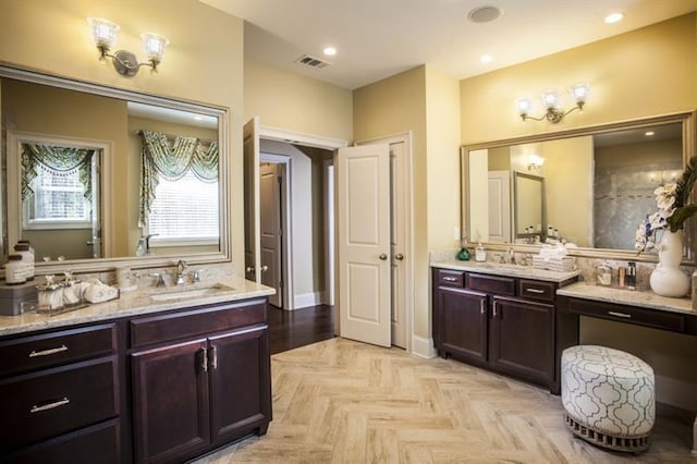 bathroom with vanity and parquet floors