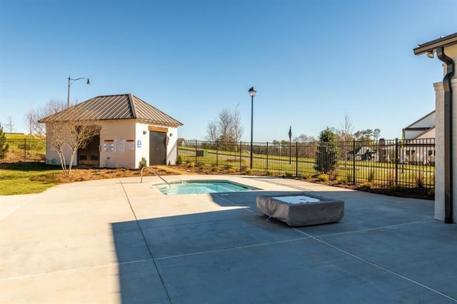 view of swimming pool with a patio area