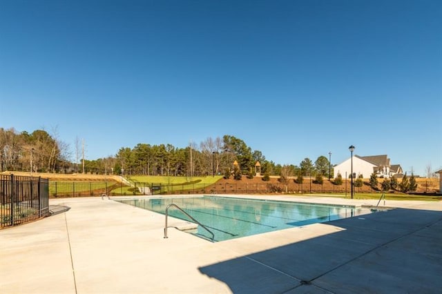 view of swimming pool featuring a patio area