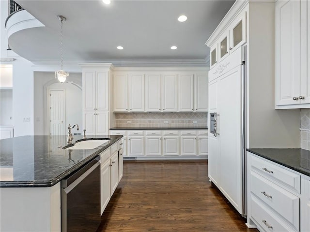 kitchen with white cabinetry, sink, dark stone counters, paneled built in refrigerator, and stainless steel dishwasher