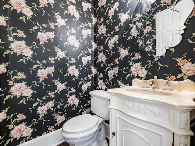 bathroom with vanity and toilet