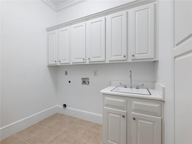 clothes washing area featuring sink, crown molding, hookup for a washing machine, cabinets, and hookup for an electric dryer