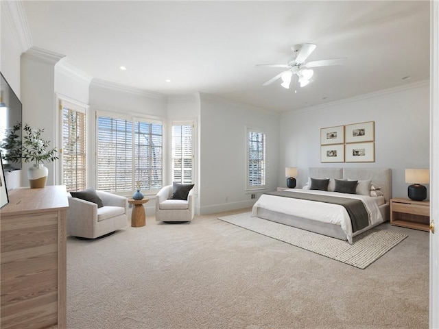 carpeted bedroom with ornamental molding and ceiling fan