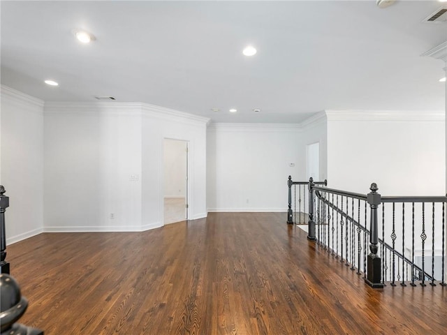 unfurnished room with crown molding and dark hardwood / wood-style flooring