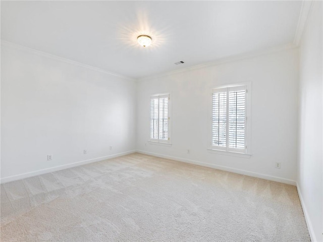 carpeted empty room with crown molding