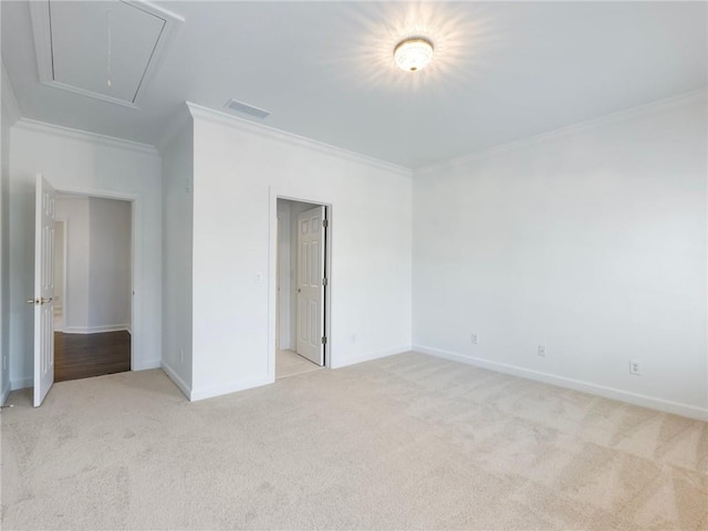 unfurnished bedroom featuring crown molding and light colored carpet