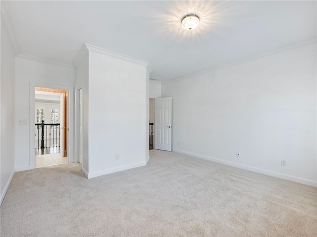 unfurnished bedroom with crown molding and light carpet